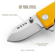 WESN Microblade fickkniv i gult, närbild på D2-stålblad