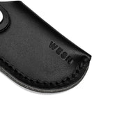 WESN Microblade läderslida i svart, närbild på prägling