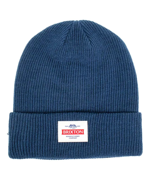 Brixton Trademark Beanie mössa i marinblått med uppvikt kant och vävd etikett